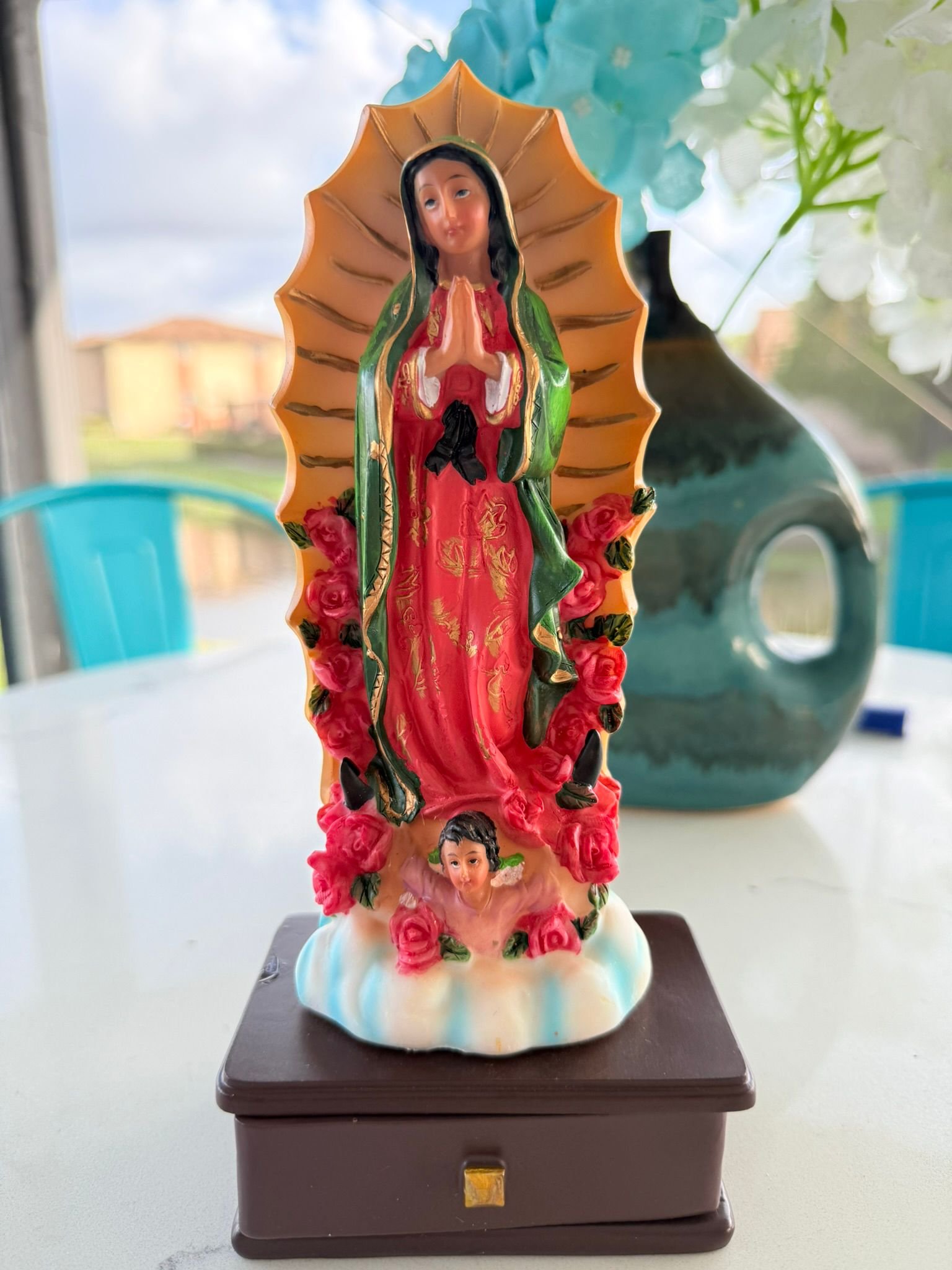 Our Lady of Guadalupe with a chest for storing petitions